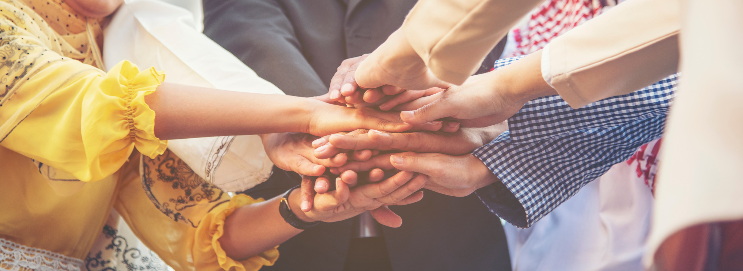 Group of people diversity multiethnic teamwork collaboration team meeting communication Unified team concept. Business people hands together diversity multiethnic diverse culture partner team meeting